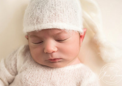 Close up of a baby boy asleep taken by Alice James Photography, newborn photographer Hertfordshire