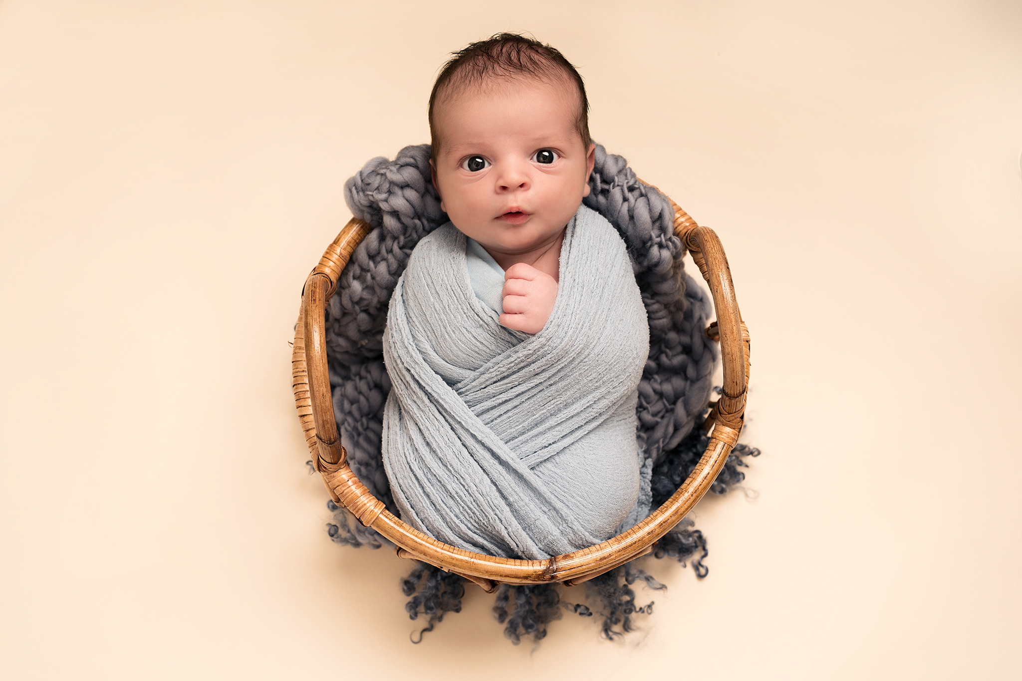baby boy wrapped in blue taken by Alice James Photography, newborn photographer Hitchin