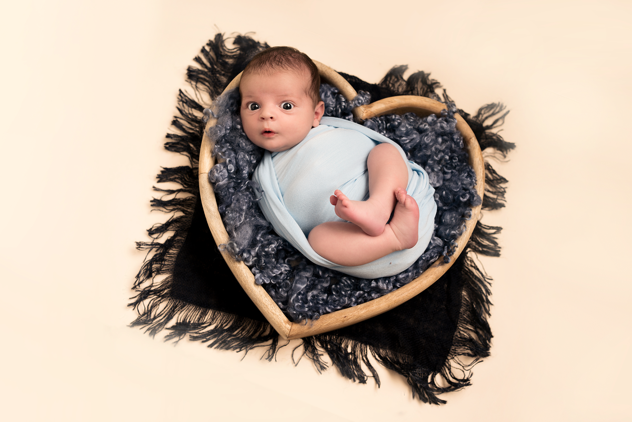 Baby boy in a heart bowl taken by newborn photographer Hertfordshire, Alice James Photography