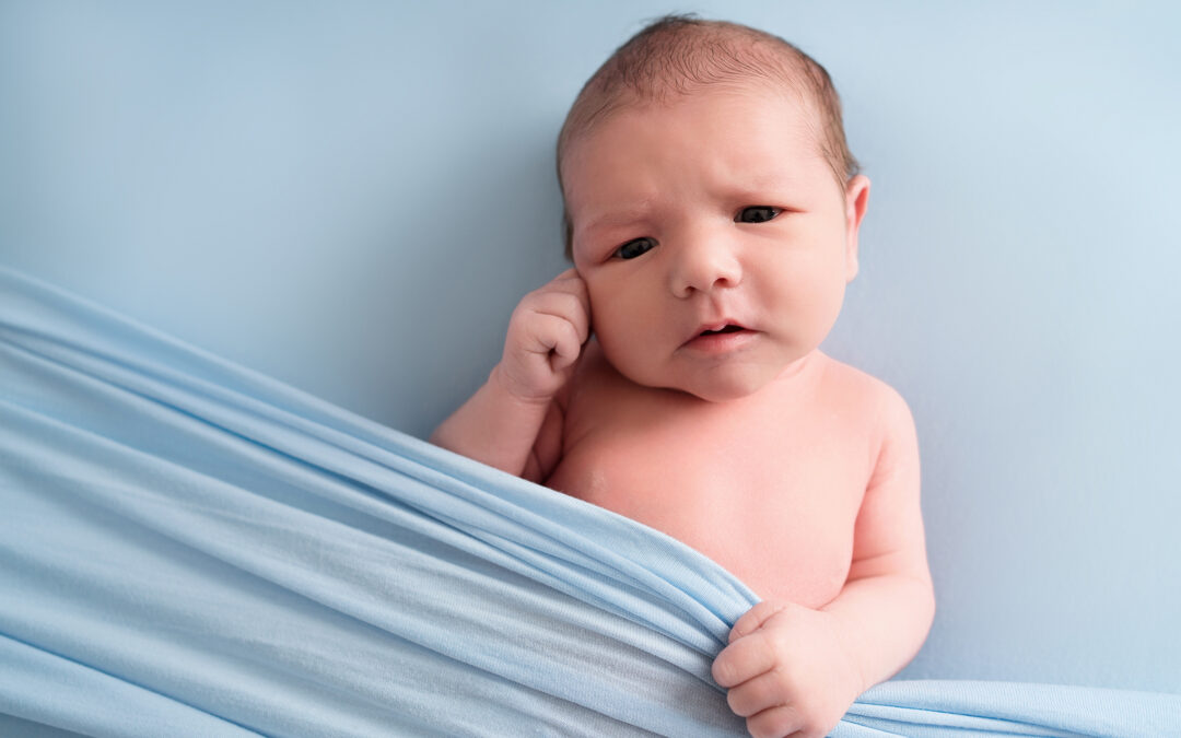 Baby boy on a blue blanket taken by Alice James Photography, newborn photographer Knebworth