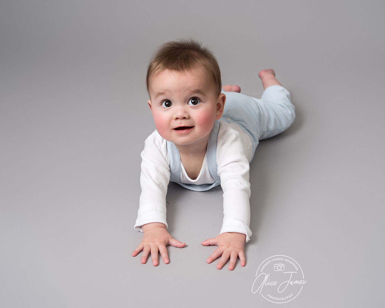 Baby boy laid on his tummy taken by Alice James Photography, Baby photographer Hitchin