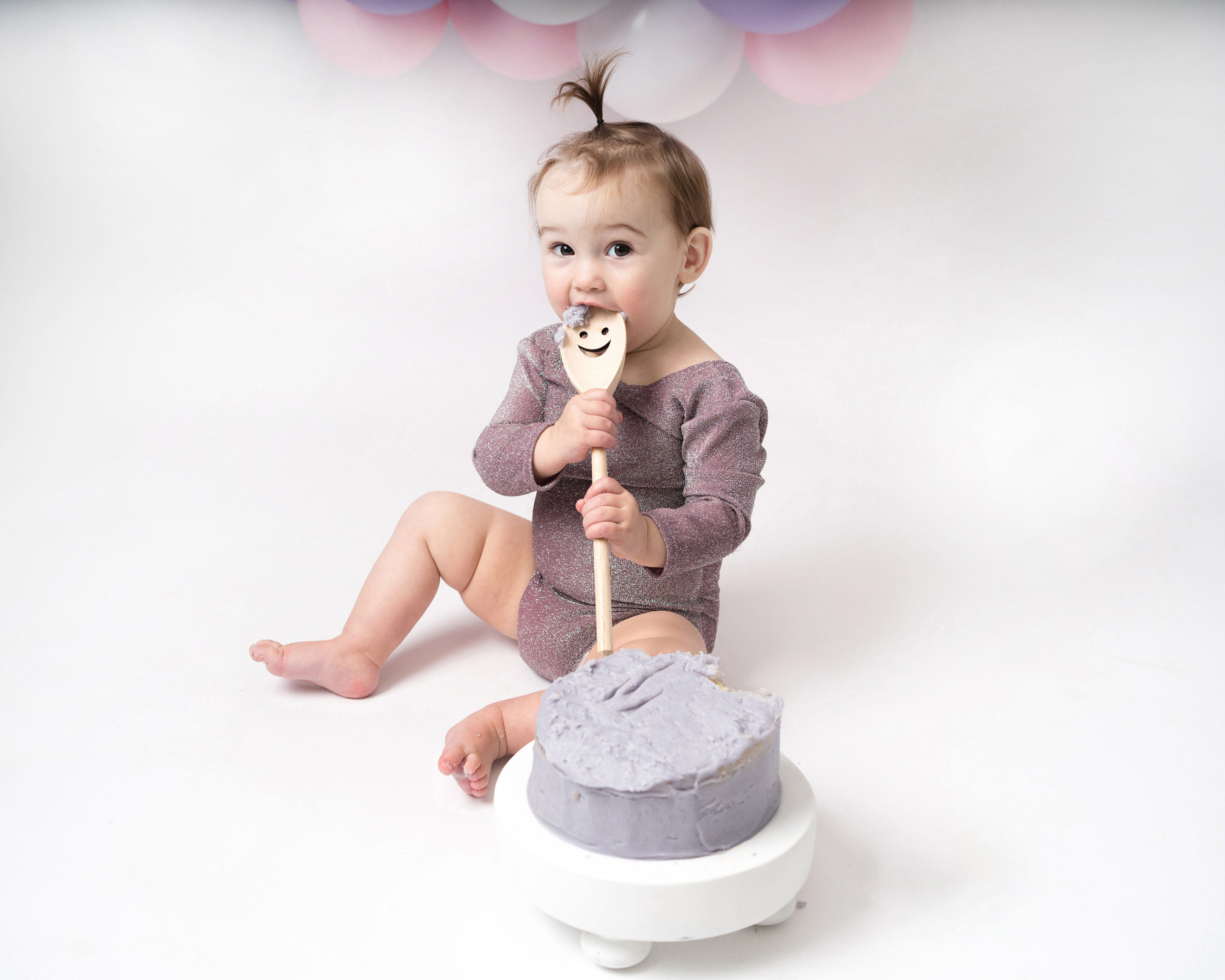 Baby girl at her cake smash photoshoot in Hitchin